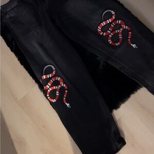 Black Jeans with Red Snake Design